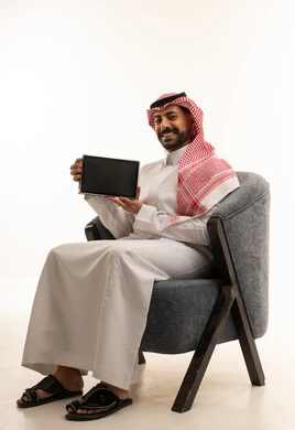 Saudi Man Holding Tablet on White Background