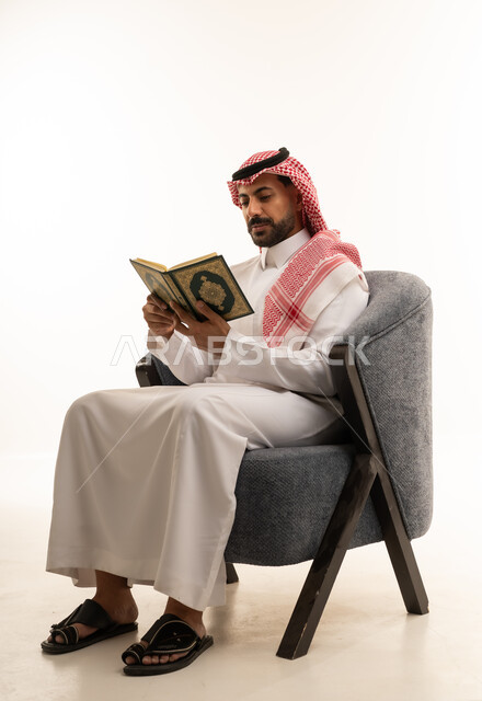 Saudi Man Reading Holy Quran in Studio