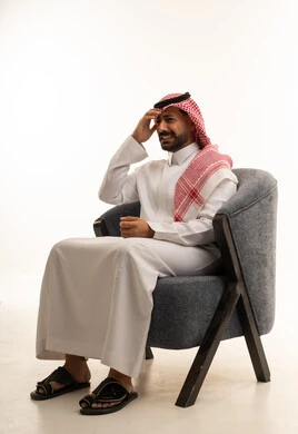 Saudi Man in Traditional Dress with Headache