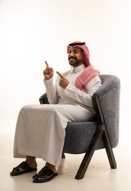 Saudi Man in Thobe Pointing Upwards in Studio