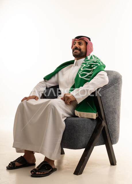 Saudi Man in Thobe with National Flag on White Background
