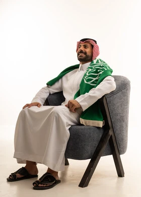 Saudi Man in Thobe with National Flag on White Background
