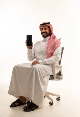 Saudi Man Holding Smartphone on Office Chair