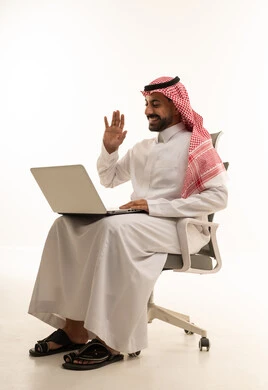 Saudi Man Waving at Laptop in Office Chair