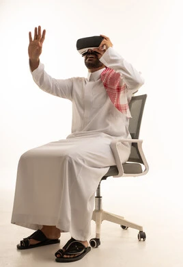 Saudi Man Wearing VR Headset in Office Chair