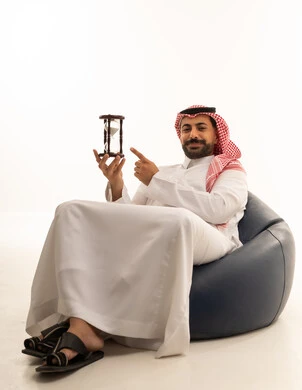 Saudi Man with Hourglass for Time Management