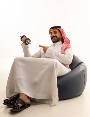 Saudi Man in Traditional Thobe Holding a Dumbbell