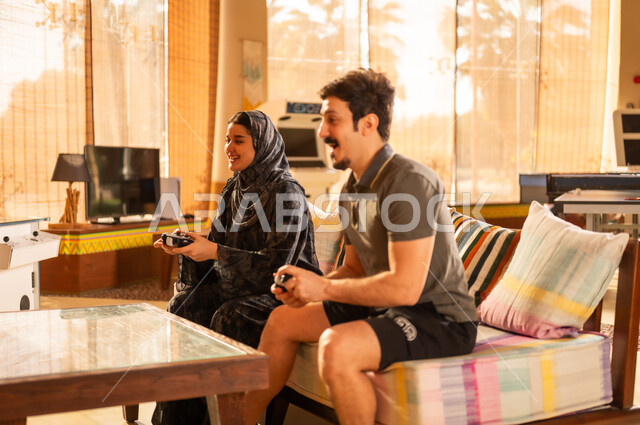 Saudi Man and Woman Playing Video Games at Home