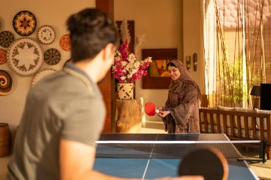 Saudi Couple Playing Table Tennis in Modern Arabic Home