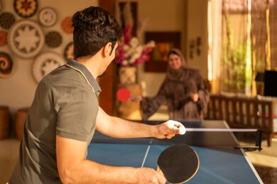 Saudi Couple Playing Table Tennis Indoor