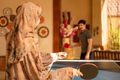 Arab Woman Playing Table Tennis Indoors