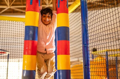 Saudi Boy Smiling at Indoor Playground Area