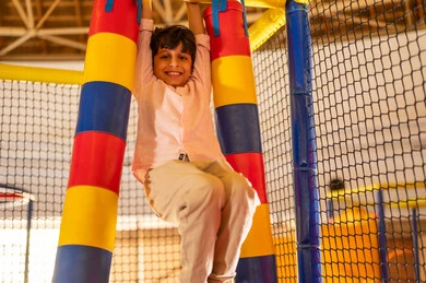Saudi Boy Playing in Indoor Entertainment Center