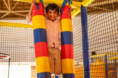 Saudi Boy Playing in Indoor Recreational Playground