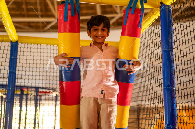 Saudi Boy Smiling in Indoor Soft Play Area