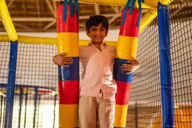 Saudi Boy Smiling in Indoor Soft Play Area