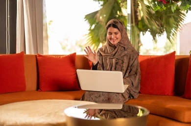 Arab Woman with Laptop Waving on Video Call