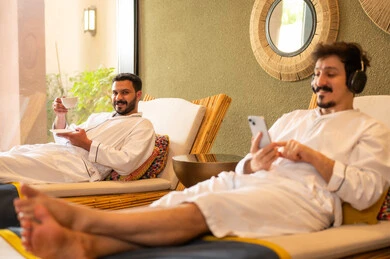Arab Men Relaxing in White Bathrobes at Luxury Spa