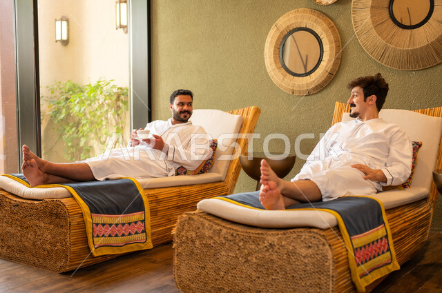 Arab Men Relaxing in Spa Wearing White Robes