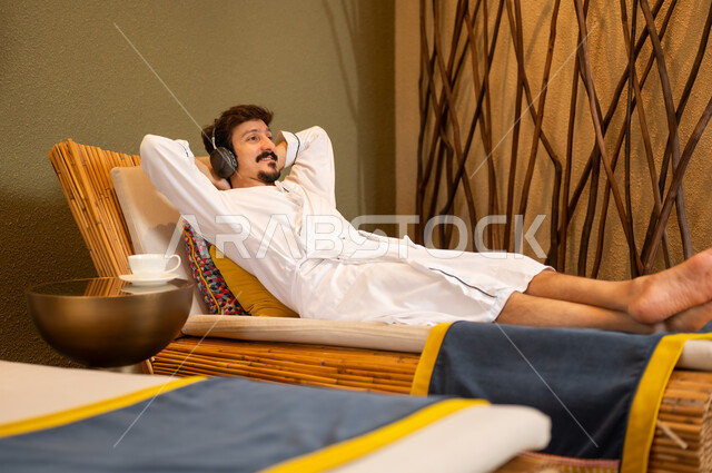 Arab Man in White Bathrobe Relaxing at Spa
