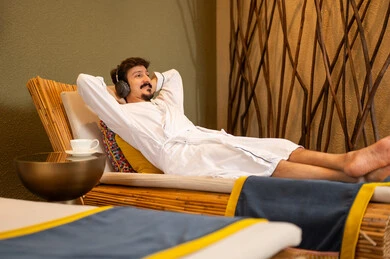 Arab Man in White Bathrobe Relaxing at Spa