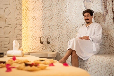Arab Man in White Robe at Traditional Turkish Bath