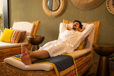 Arab Man Relaxing in Spa Wearing White Bathrobe