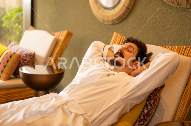 Saudi Man in White Bathrobe Relaxing at Luxury Spa