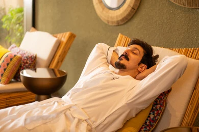 Saudi Man in White Bathrobe Relaxing at Luxury Spa