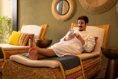 Saudi Man Using Smartphone in Luxury Spa