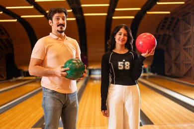 Saudi Man and Woman in Bowling Alley Interior