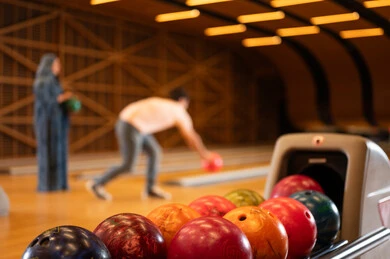 Saudi Man and Woman Playing Bowling Indoors
