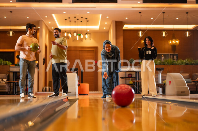 Arab Friends Playing Bowling at Indoor Entertainment Center