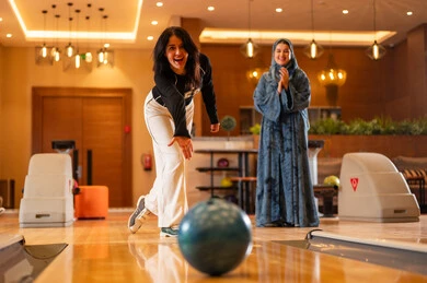 Saudi Women Playing Bowling in Modern Indoor Center