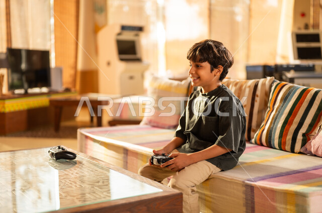 Middle Eastern Boy Playing Video Games at Home