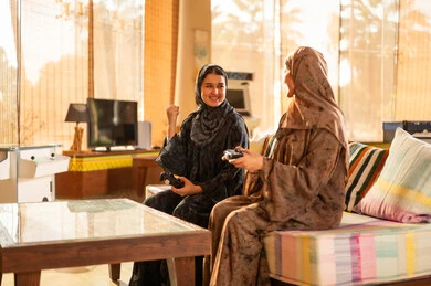 Saudi Women Playing Video Games in Living Room