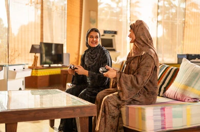 Arab Women Playing Video Games in Traditional Abaya