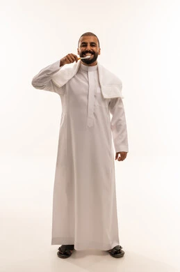 Saudi Man in White Thobe Brushing Teeth on White Background