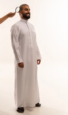 Saudi Man Scalp Examination with Magnifying Glass