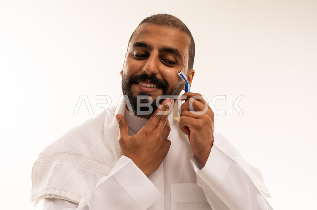 Saudi Man Shaving His Beard with Manual Razor