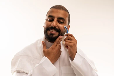 Saudi Man Shaving His Beard with Manual Razor