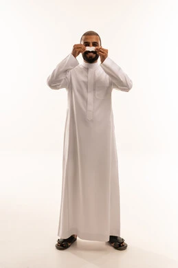 Saudi Man in White Thobe Holding Paper Mustache