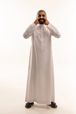 Smiling Saudi Man in White Thobe Studio Portrait