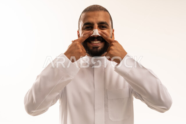 Saudi Man Wearing Nasal Strip in White Thobe