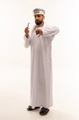 Omani Man with Razor Giving Thumbs Down Sign