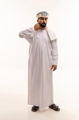 Omani Man in Traditional Dishdasha and Kummah