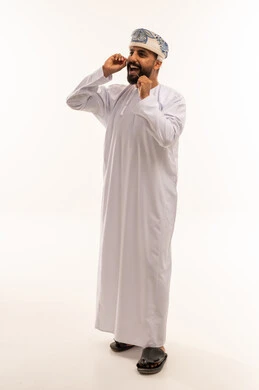Omani Man in Traditional Dishdasha Laughing Studio Shot