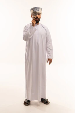Omani Man Looking Through Magnifying Glass on White Background