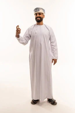 Omani Man in Traditional Dishdasha Holding Perfume