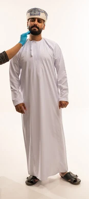 Omani Man in Traditional Dress Medical Chin Exam
